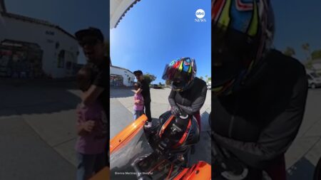 Motorcyclist lets girl rev bike for first time
