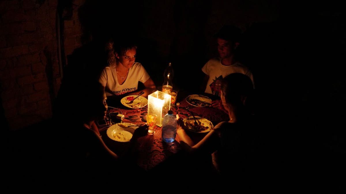 Family has dinner during power blackout