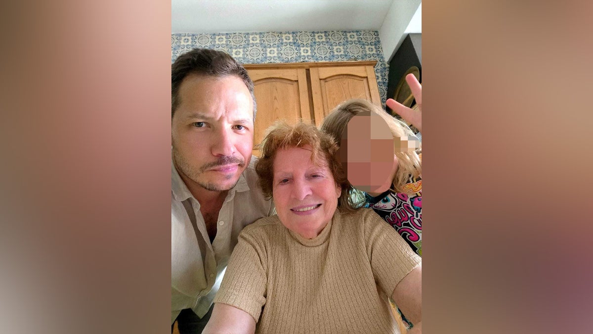 Alexandre Rocha with his grandmother and his son.