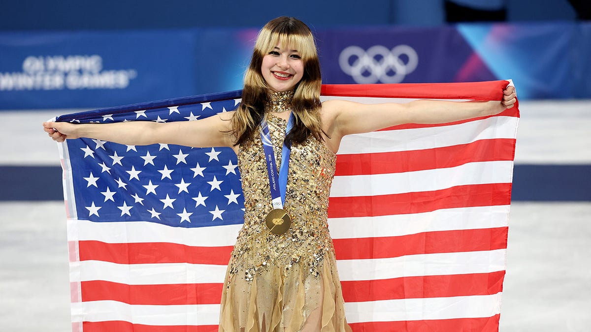 Alysa Liu holds American flag after medal skate