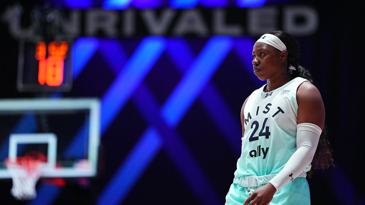 Arike Ogunbowale looks on during a basketball game