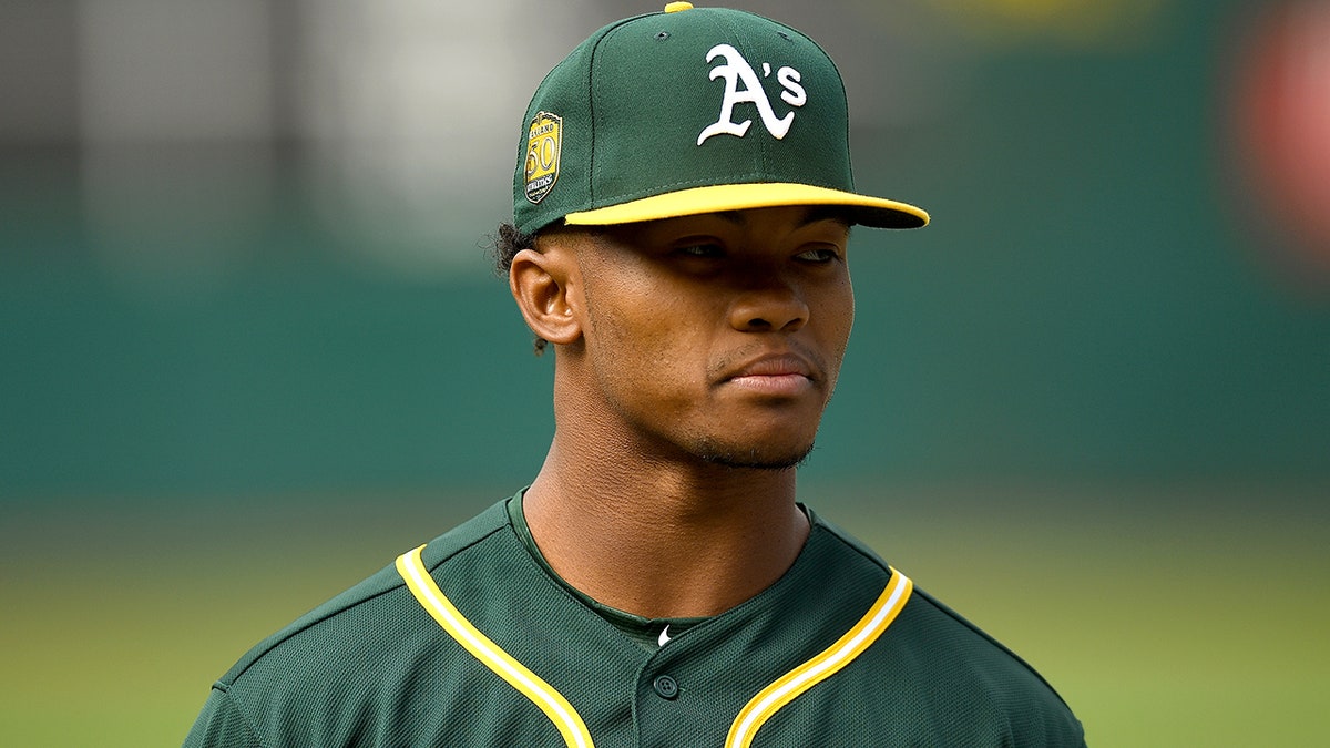 Kyler Murray standing during batting practice at Oakland-Alameda County Coliseum