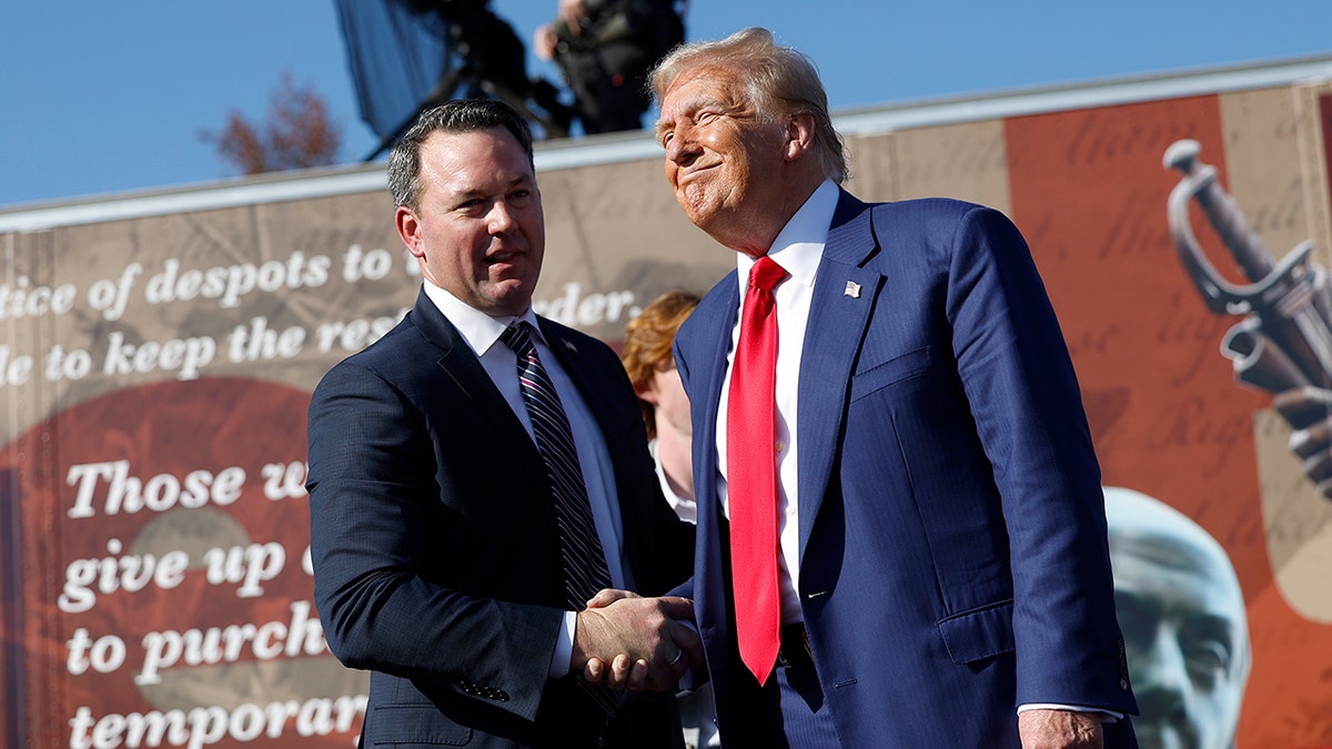 Trump shaking hands with Georgia Lt. Gov. Burt Jones in 2024