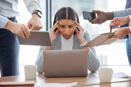 A staggering amount of burned-out workers say they’re doing 3 jobs at once — without a raise or promotion