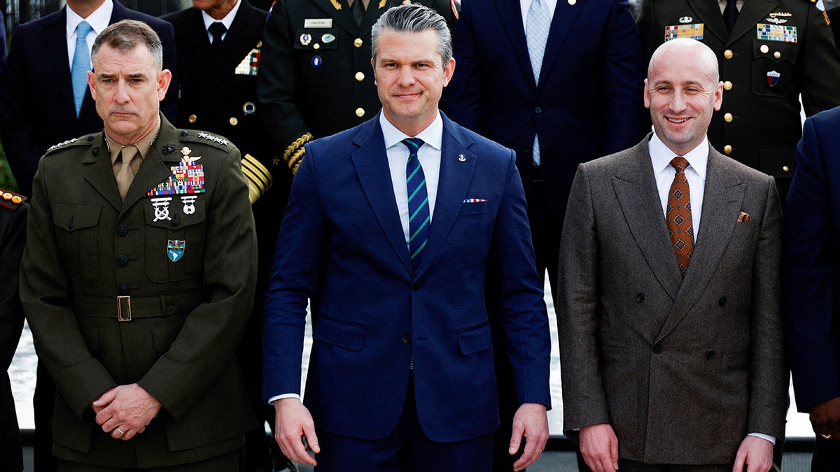Stephen Miller, Pete Hegseth, and Francis Donovan posing for a portrait outside at U.S. Southern Command.