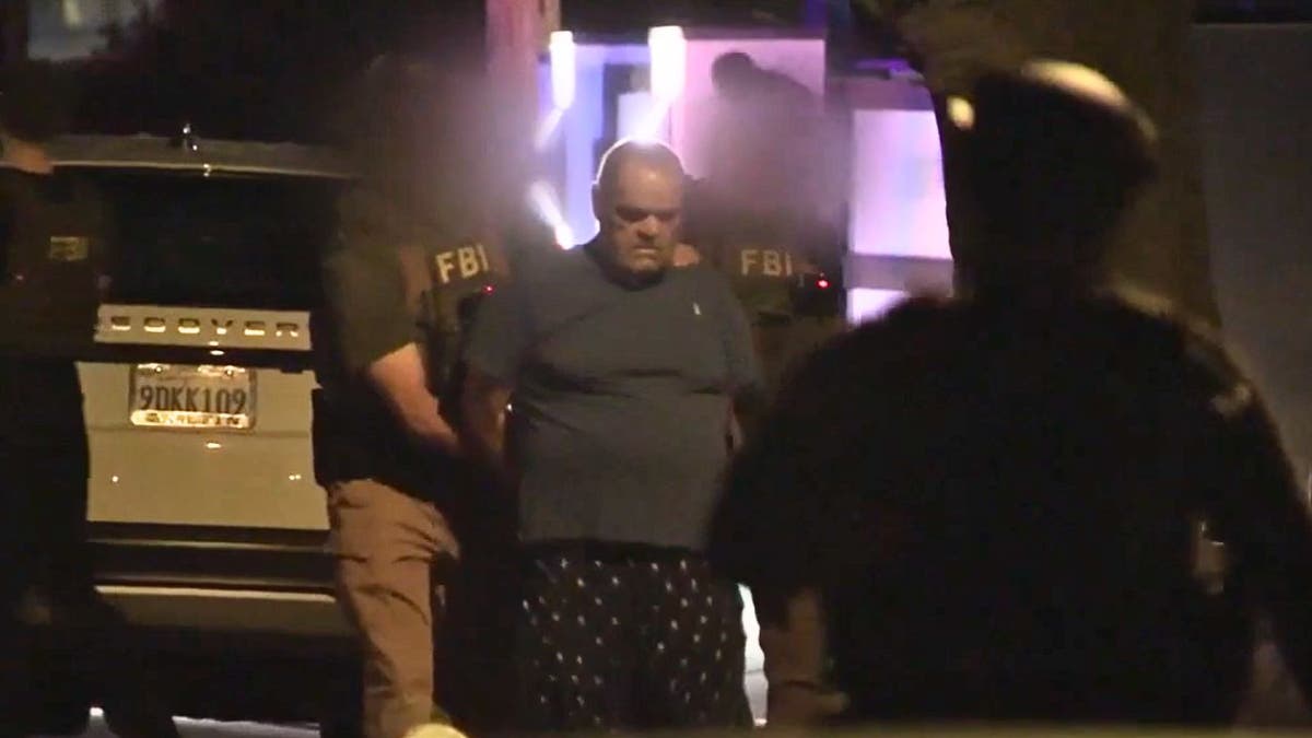 fbi-hollywood-mansion-raid-arrest-pajamas