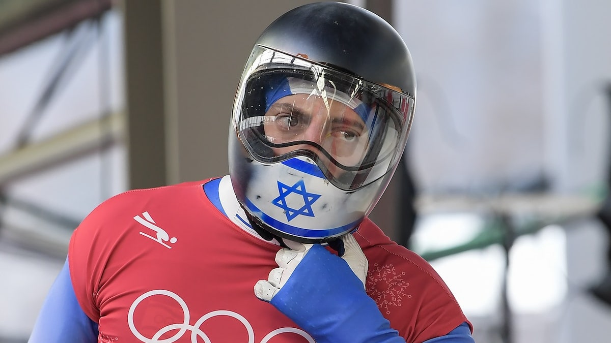 Israel's Adam Edelman takes off his helmet after a training session for the mens's skeleton during the Pyeongchang 2018 Winter Olympic Games, at the Olympic Sliding Centre on February 14, 2018.
