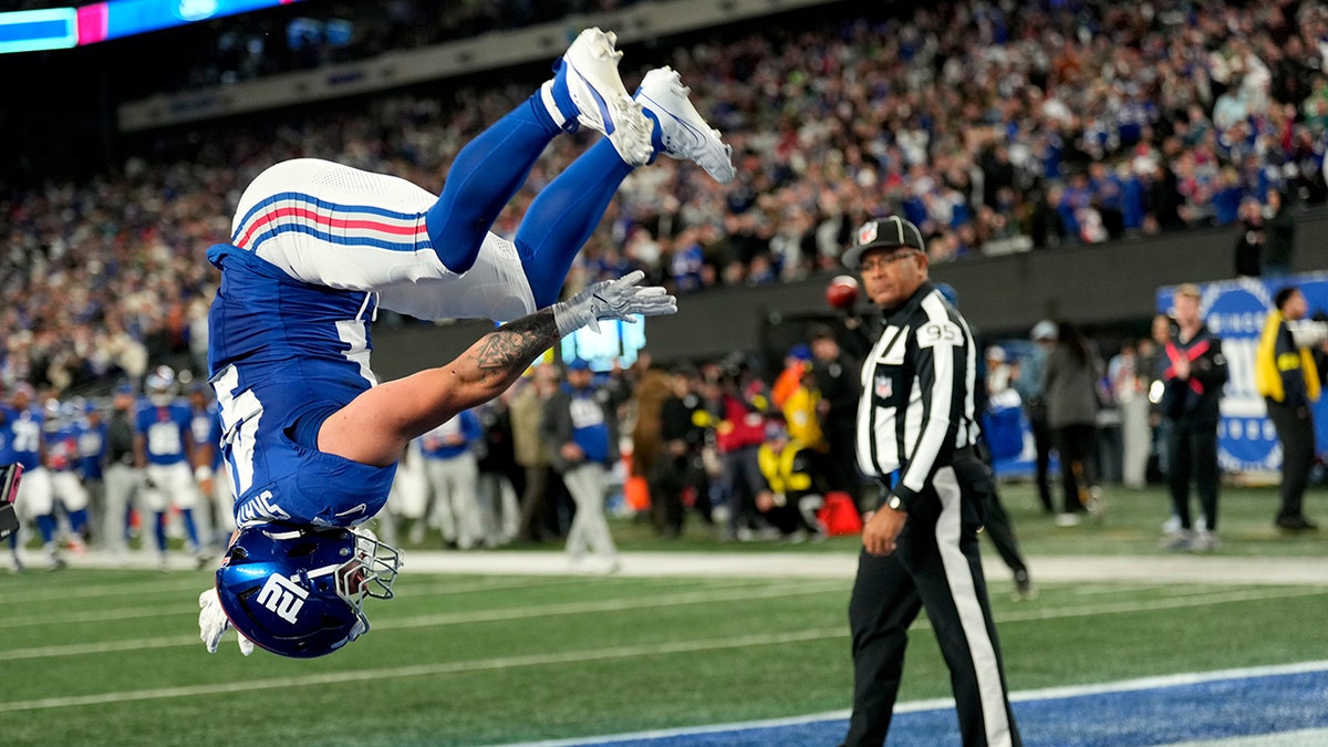 Cam Skattebo backflips after touchdown