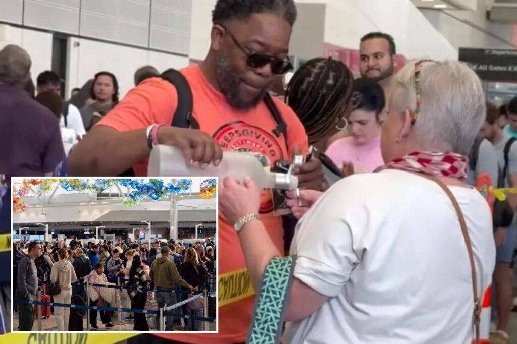 Traveler hands out vodka shots to adults in massive TSA line amid US airport lines and delays Traveler hands out vodka shots to adults in massive TSA line amid US airport lines and delays