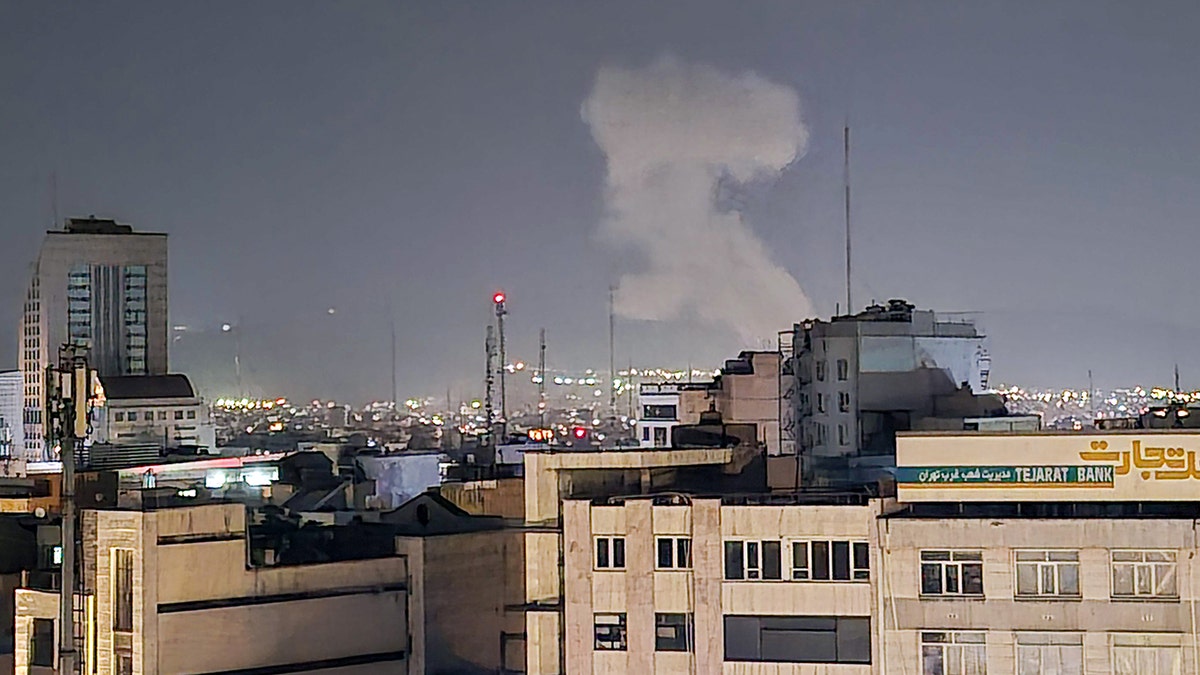 Smoke rises in Tehran after a wave of Israeli strikes