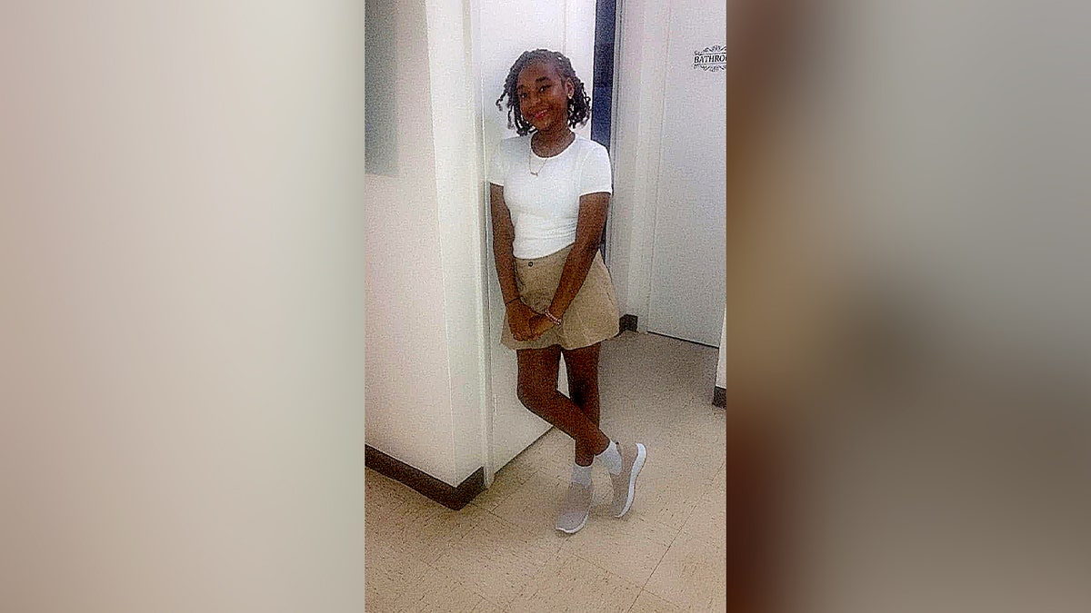 jada west posing and smiling for a photo