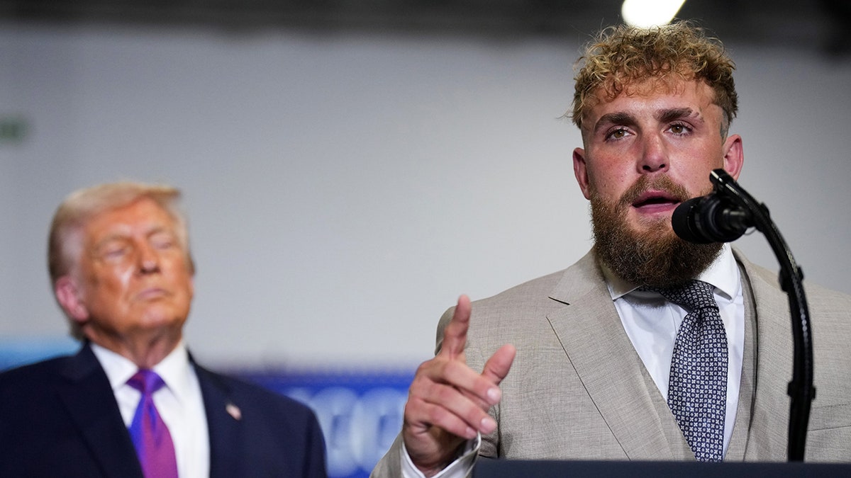 Jake Paul speaks as President Donald Trump looks on