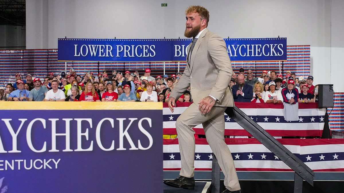 Jake Paul takes the stage during an event