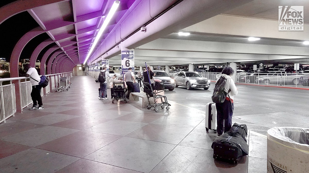 Tourists wait for rides at airport in Las Vegas.