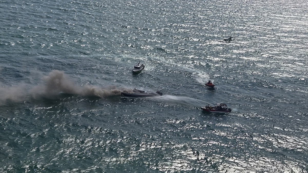 A tourist boat goes up in flames off the coast of Miami Beach, Florida
