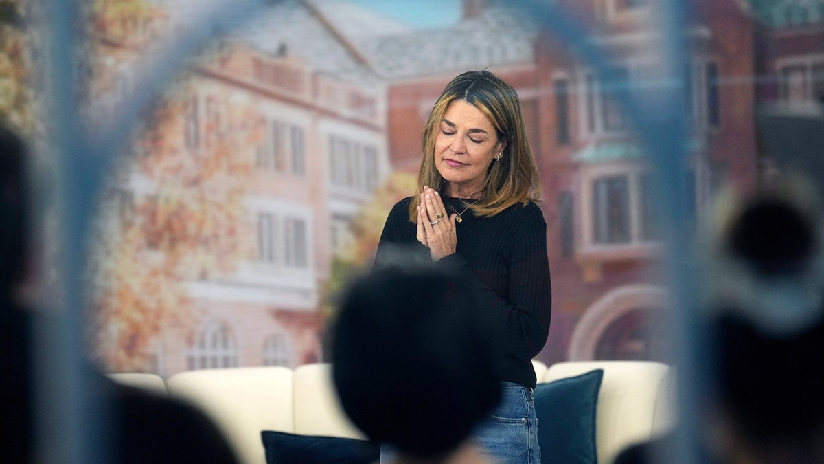 Savannah Guthrie standing on the Today show set at Rockefeller Plaza.