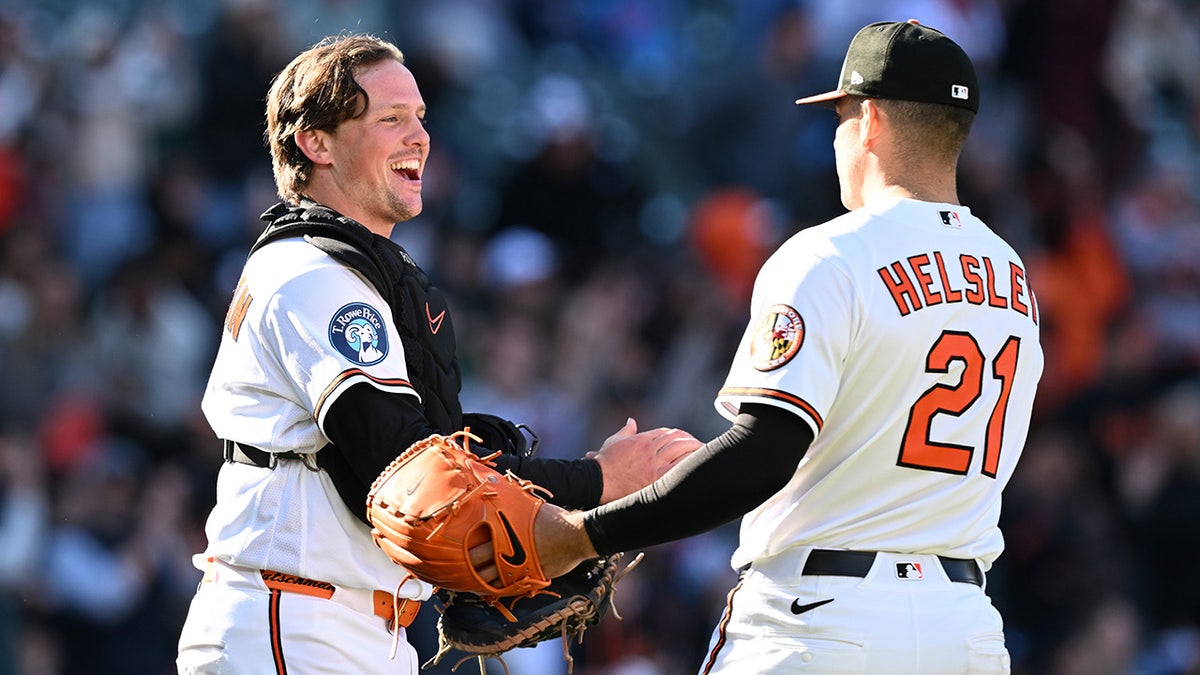 Orioles players celebrate a win in March 2026