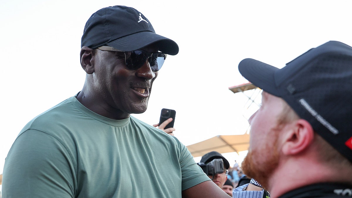Michael Jordan celebrates with Tyler Reddick
