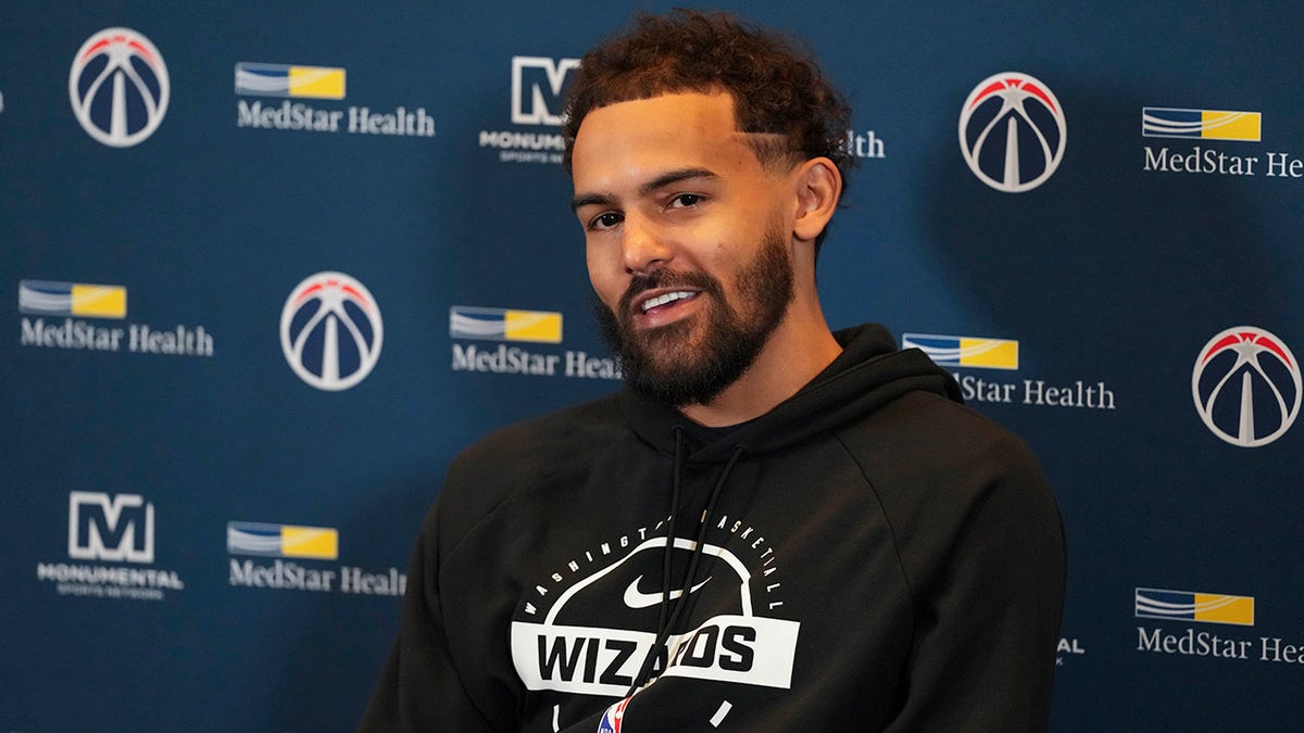 Trae Young talks to reporters