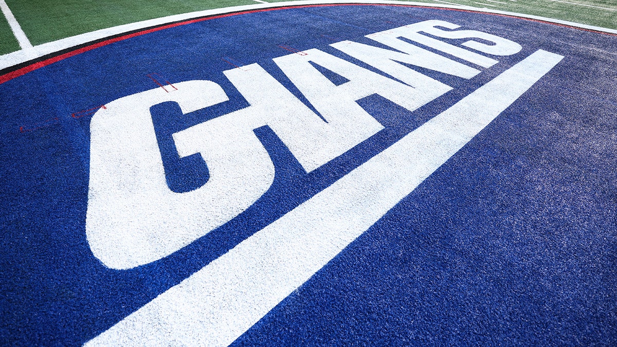 A New York Giants logo painted on turf