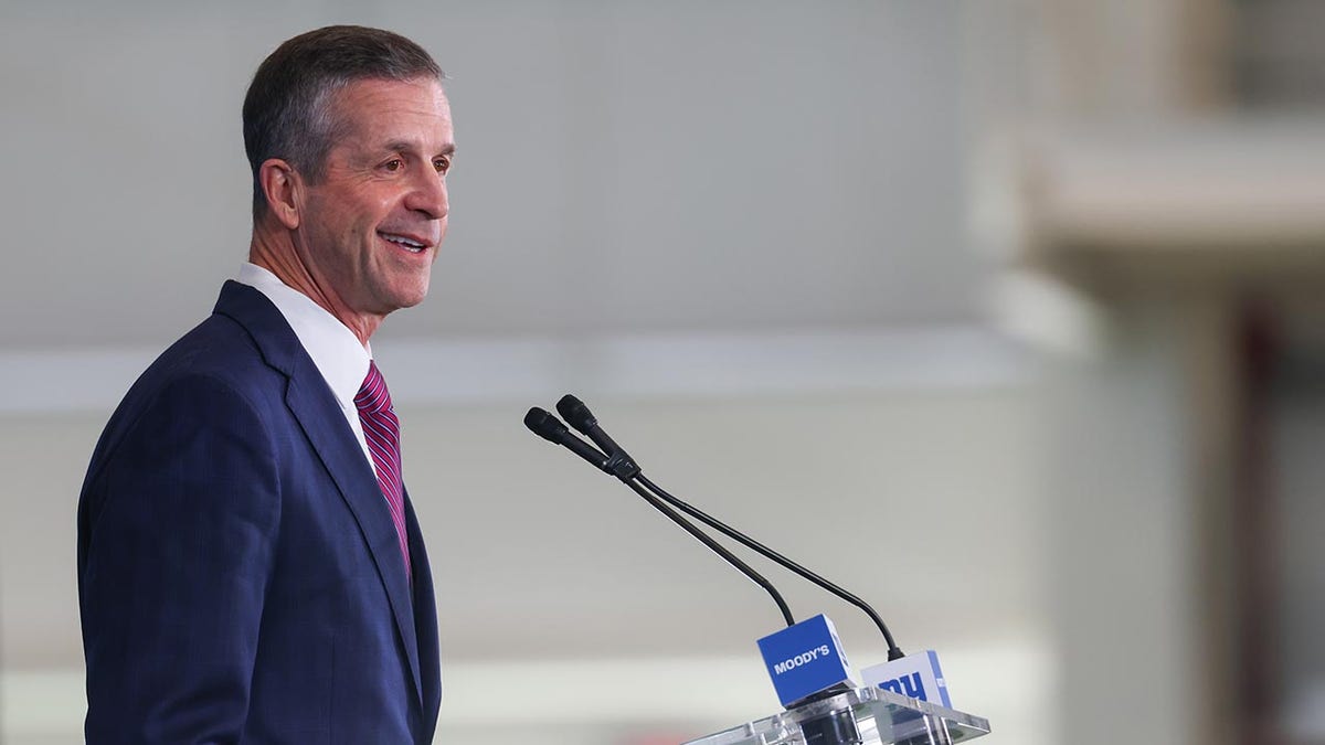 John Harbaugh speaks at a press conference