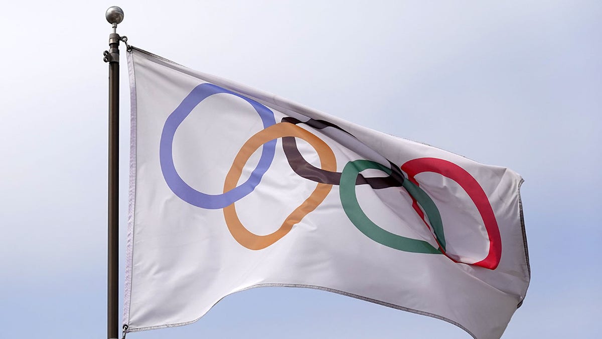 An Olympic rings flag