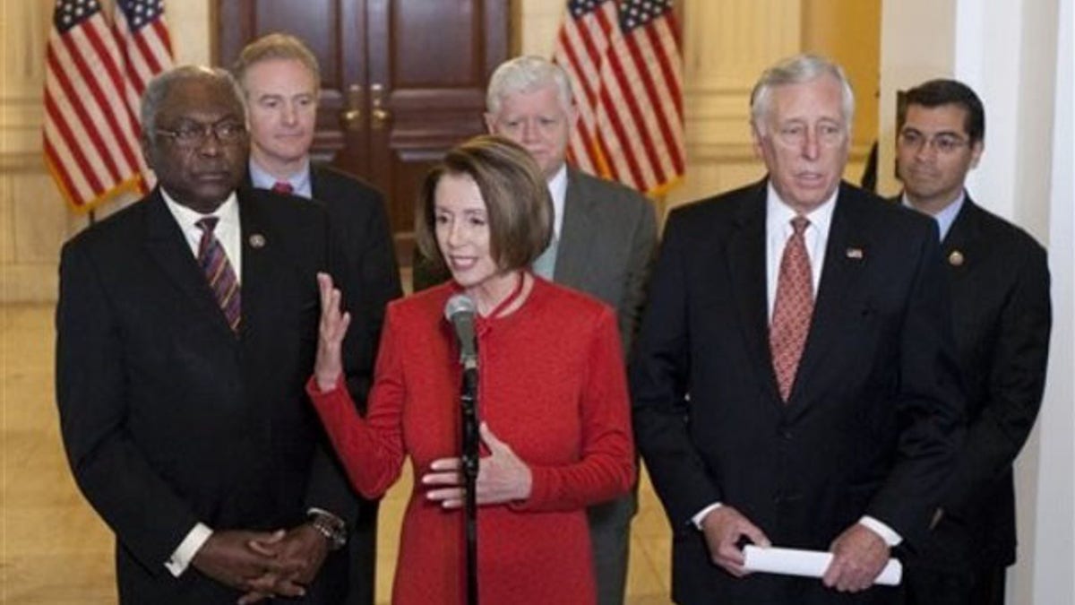 Democratic leaders, Speaker Nancy Pelosi, Majority Whip James Clyburn and Rep. Steny Hoyer, seen here in November, are working to limit losses of Democratic seats in the 2010 election, but recognize the historic challenges. In the back are Rep. Chris Van Hollen, Rep. John Larson and Rep. Xavier Becerra (AP Photo).