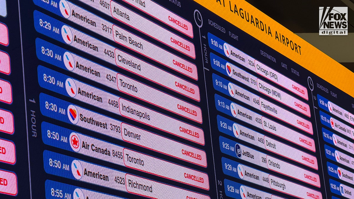 A departures board at LaGuardia Airport showing a list of canceled flights.
