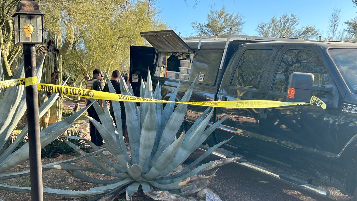 Crime scene tape around a truck