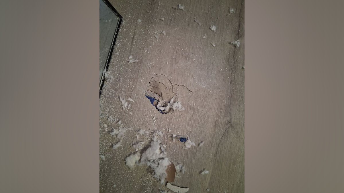 Debris was seen near the area the large rock landed.