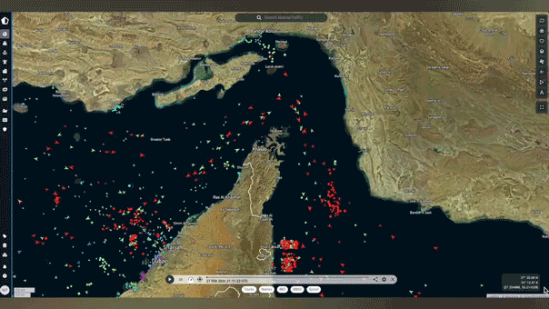 Marine vessels moving through the Strait of Hormuz in a timelapse video.