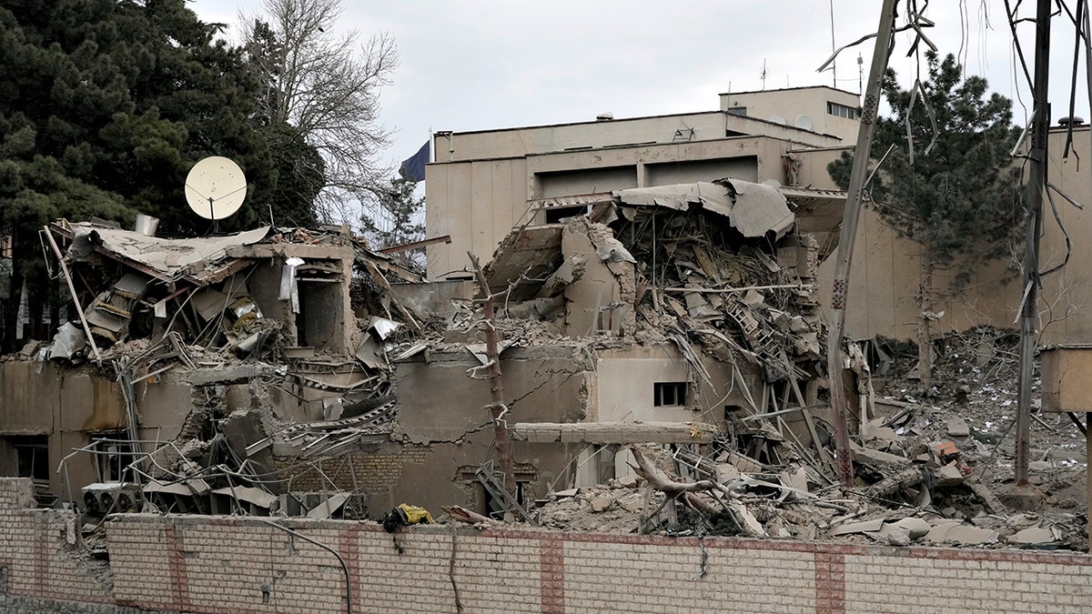 state TV communications tower and building damaged