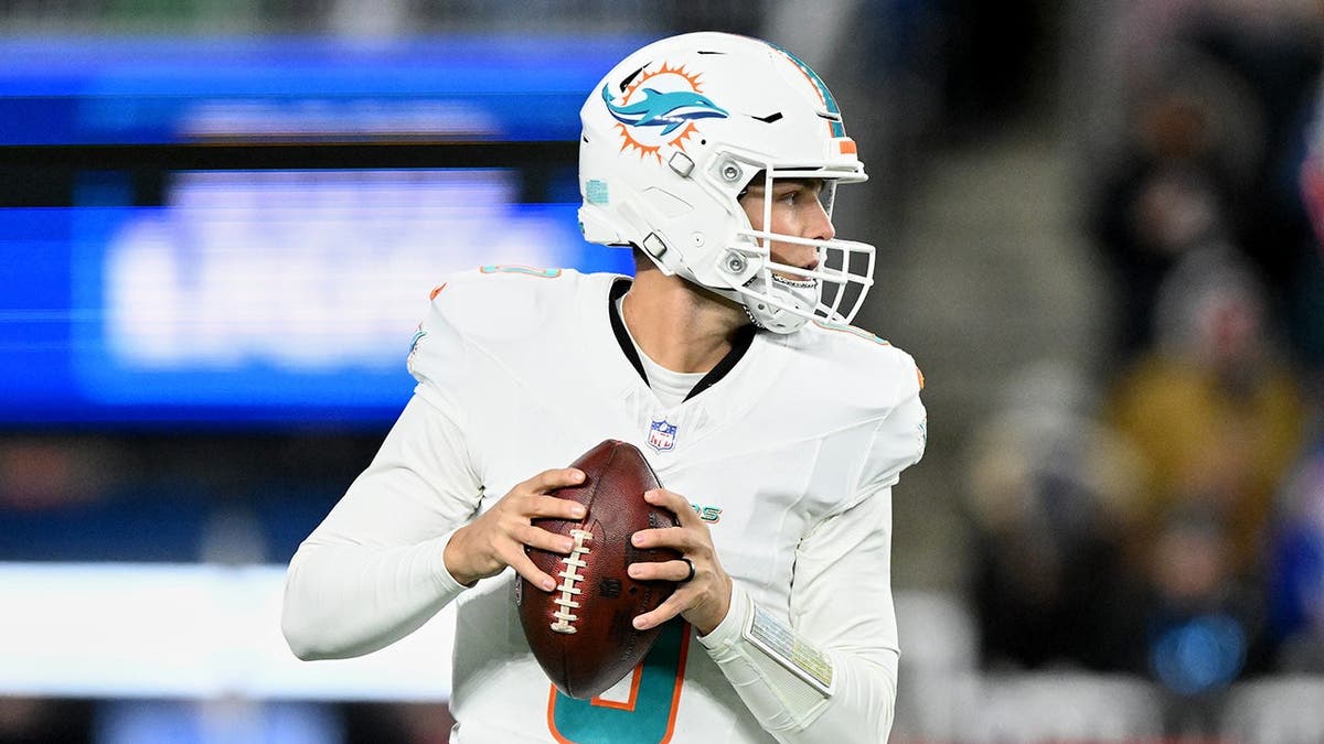 Dolphins' Zach Wilson looks to throw