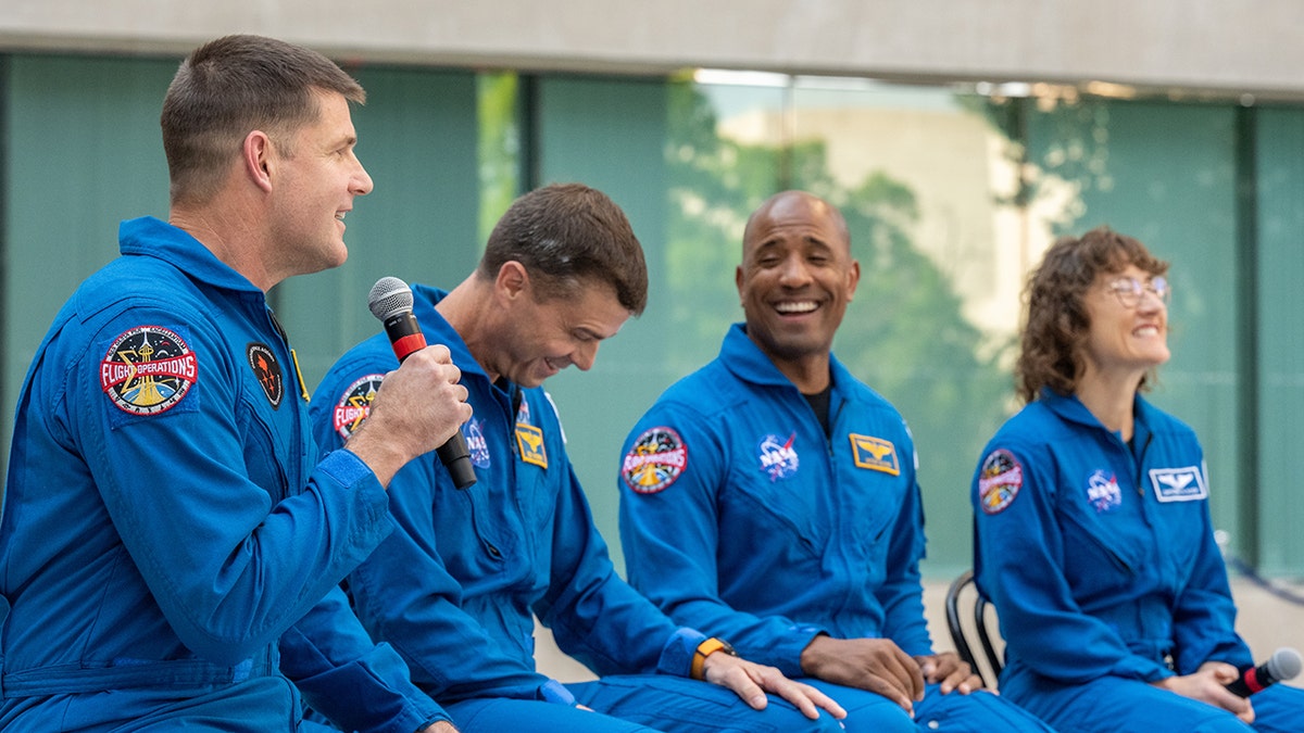 Astronauts Jeremy Hansen, Reid Wiseman, Victor Glover, and Christina Hammock Koch standing outside the Canadian Embassy in Washington