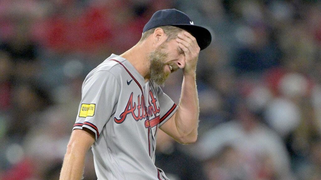 Braves ace Chris Sale slams baseball against his head after walking the bases loaded in wild scene