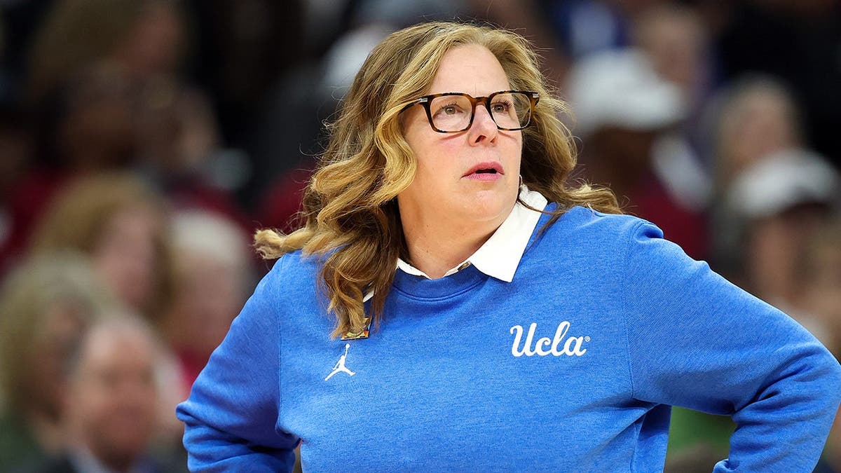 Head coach Cori Close of UCLA Bruins watching game during NCAA women's basketball championship.