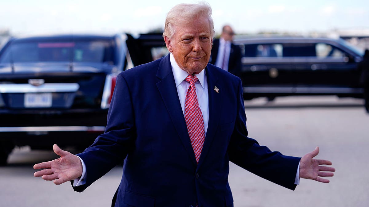 President Donald Trump shrugging during a public appearance.