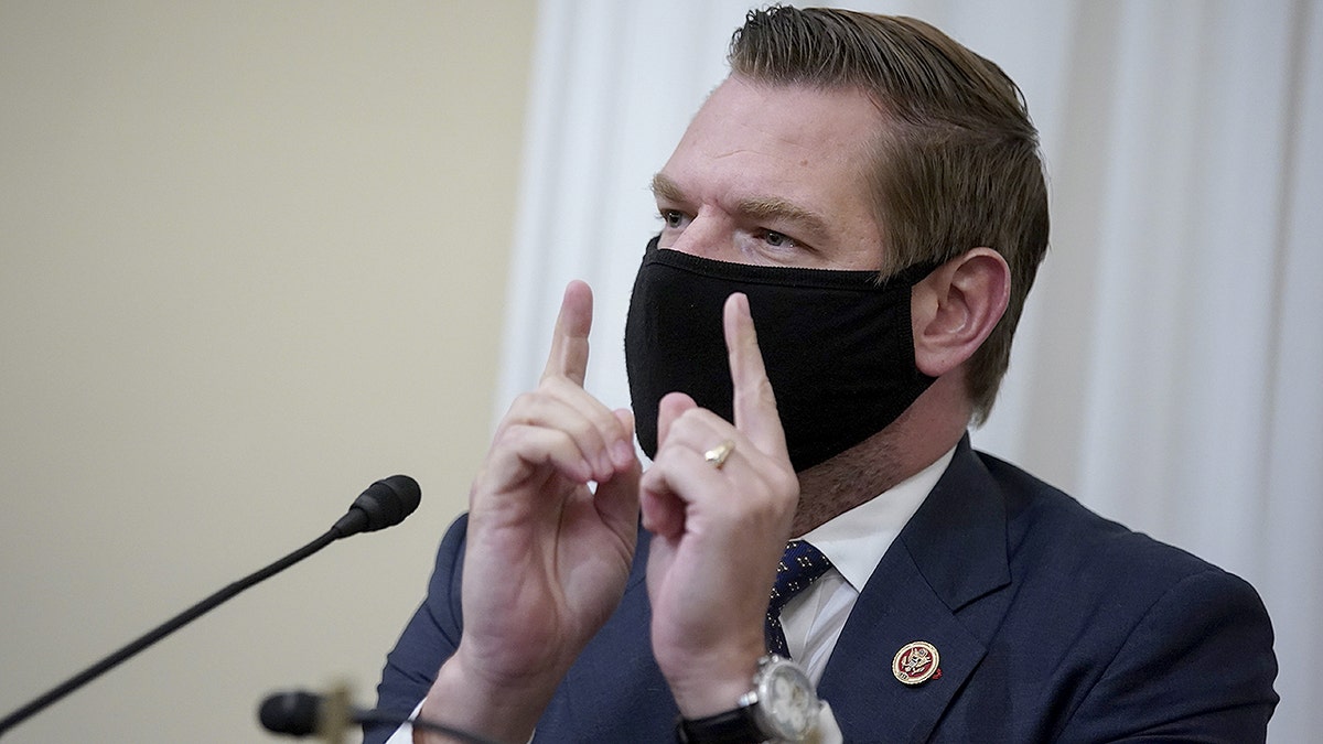 Rep. Eric Swalwell wearing a protective mask speaking during a House Intelligence Committee hearing in Washington, D.C.