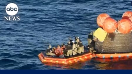 Astronauts exit spacecraft after successful splashdown