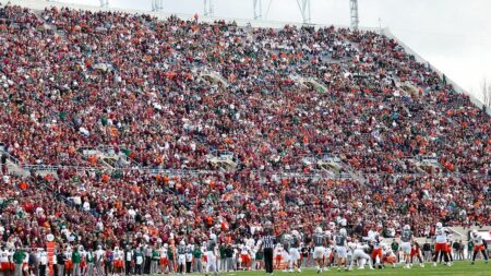 Skydiver’s parachute gets stuck on scoreboard at Virginia Tech spring game in harrowing scene