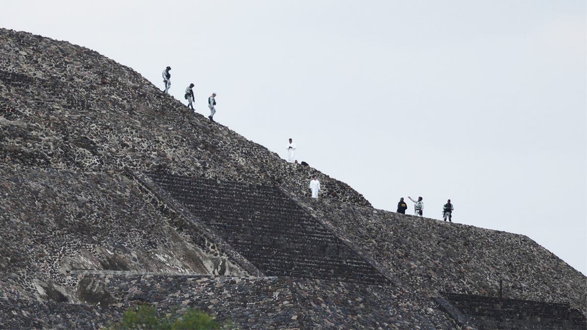 police on ancient pyramid in Teotihuacan, Mexico