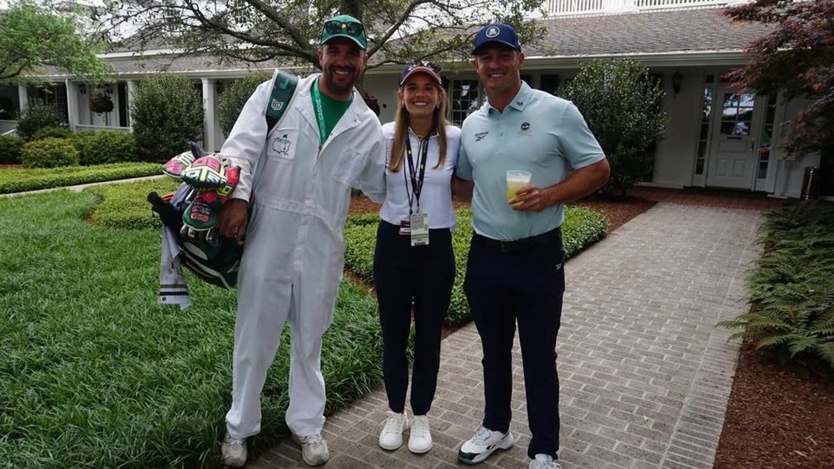 Kai Trump posing for a photo with Bryson DeChambeau at Augusta National Golf Club