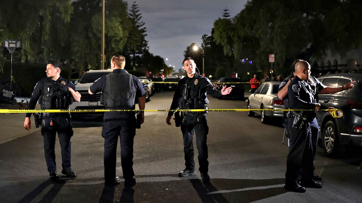 Police secure street outside suspect's home in Torrance, California