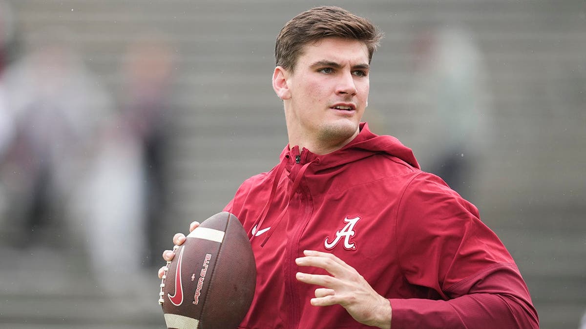 Ty Simpson warming up on the field at Rose Bowl Stadium in Pasadena, California
