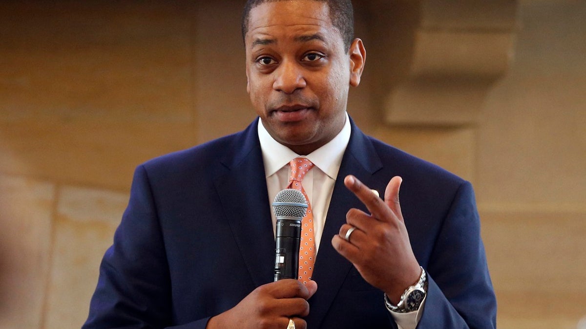Then-Virginia Lt. Gov. Justin Fairfax gestures during remarks before a meeting of the Campaign to reduce evictions at a church meeting room in Richmond, Va. 
