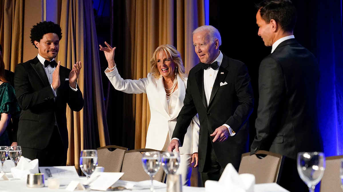 President Joe Biden and first lady Jill Biden arriving at White House Correspondents' Association dinner with comedian Trevor Noah