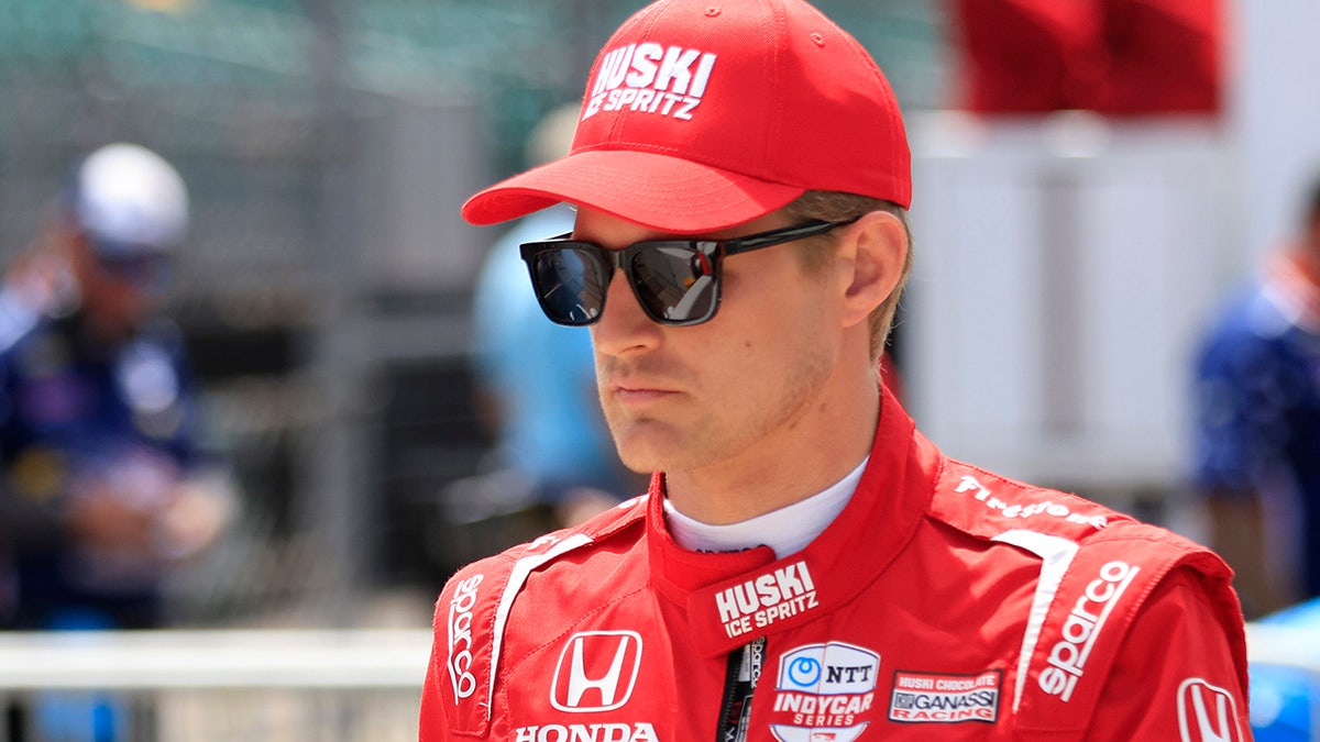 Marcus Ericsson walking to his #8 Huski Chocolate Chip Ganassi Racing Honda at Indianapolis Motor Speedway