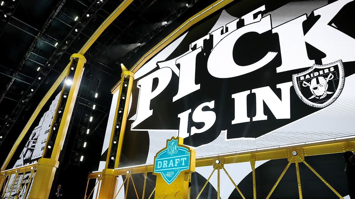 The Raiders pick card displayed at NFL Draft stage