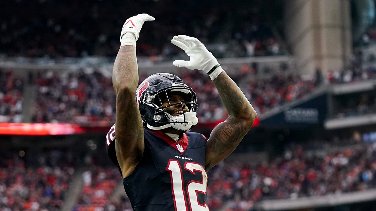 Nico Collins of the Houston Texans celebrates after scoring a touchdown at NRG Stadium in Houston