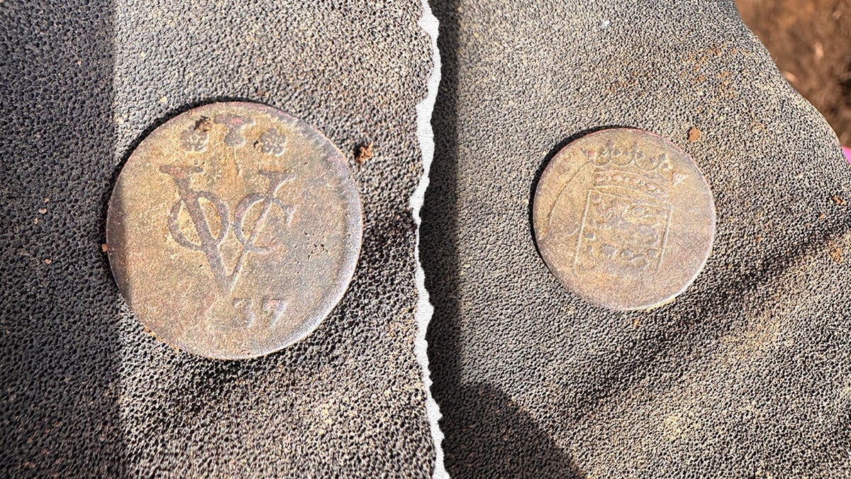View of front and back side of 18th-century coin found at site